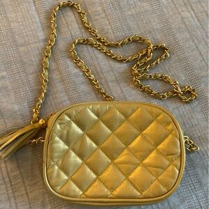 Moda leather quilted gold small purse.  Gold and leather chain with tassel.​